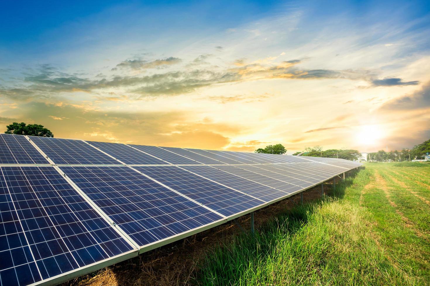 solar-panel-cell-on-dramatic-sunset-sky-background-free-photo